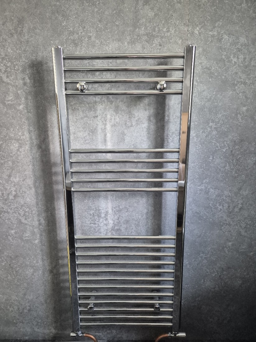Chrome heated towel radiator fitted as a finishing touch